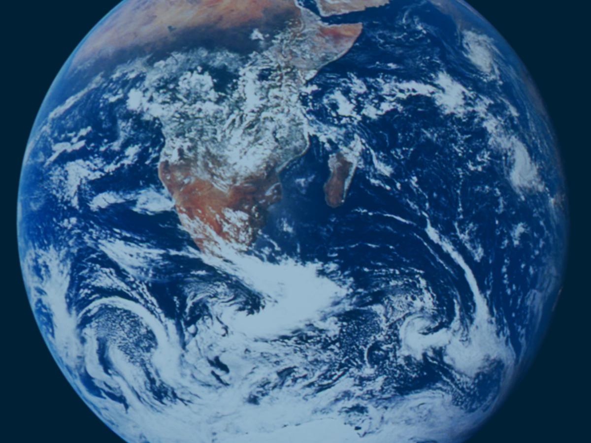 Planet Earth viewed in totality from space. Africa and Arabia are visible under some cloud in the south.