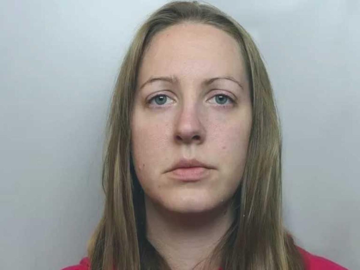 A prisoner looks into the camera.
