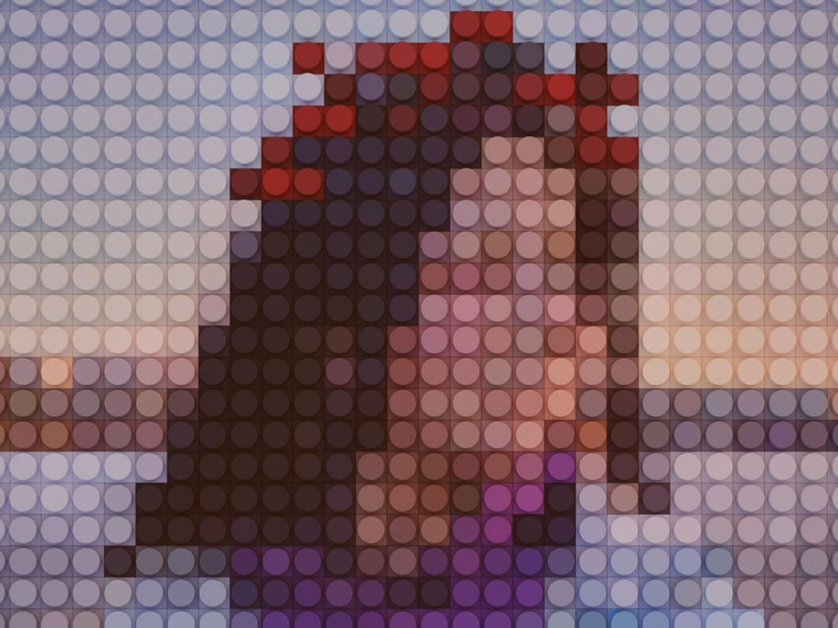 A head and shoulders portrait consisting of large disc-like pixels that obscure the real person..