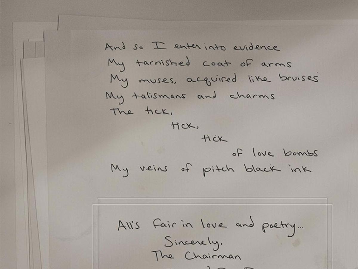 Hand-written poetry on a page