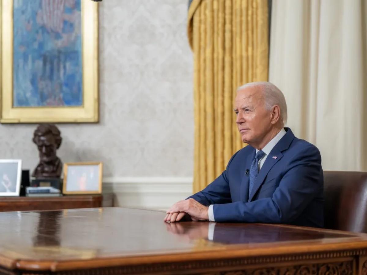 President Biden, at his desk after announcing his decision.