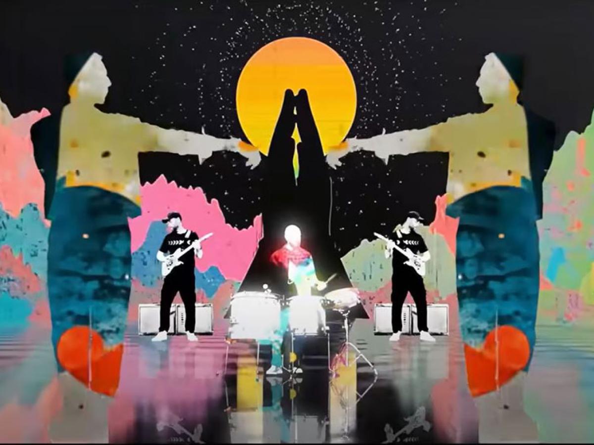 A colourful graphic overlay of praying hands over a band playing.