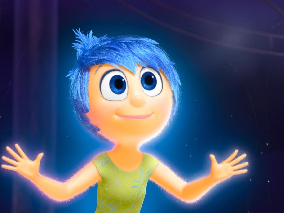 Cartoon character Joy looks up with arms held open.