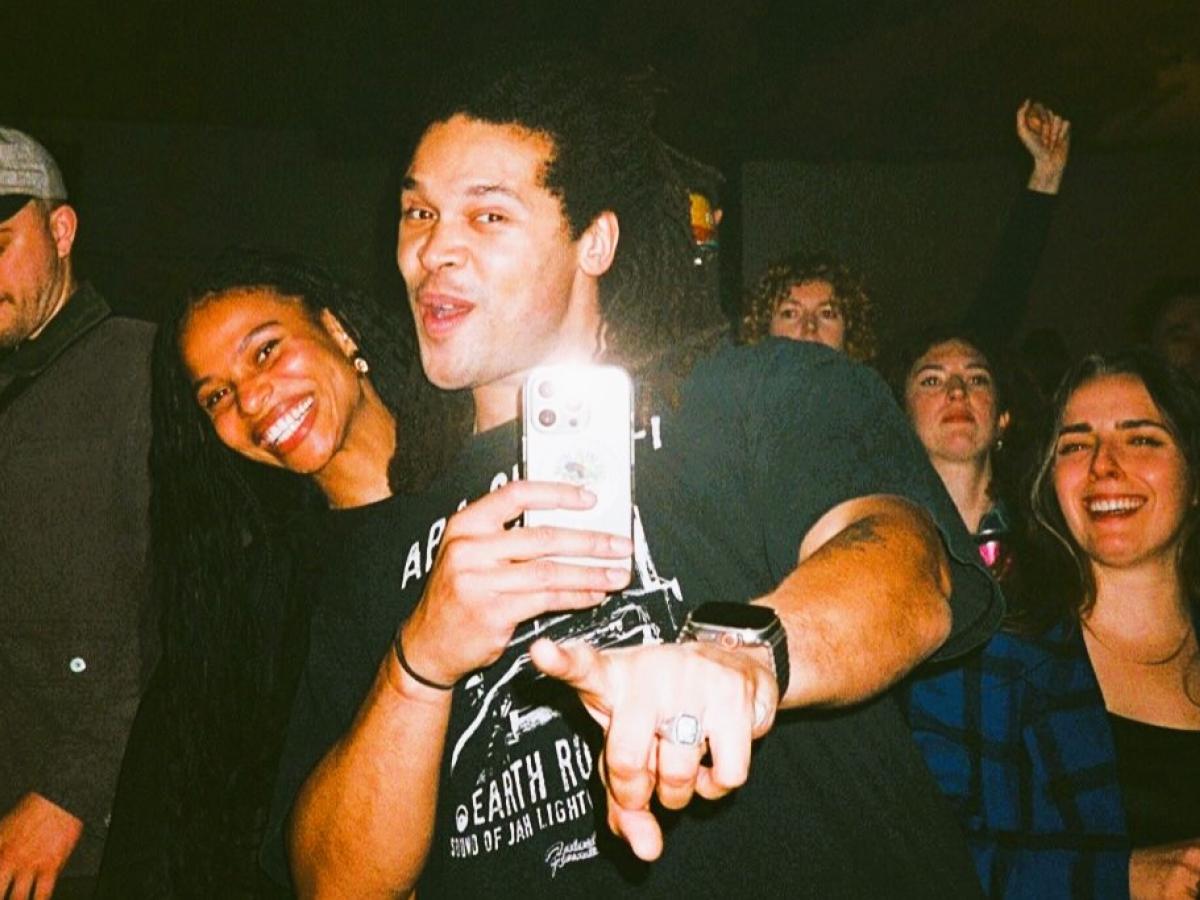 Ravers pose together for a selfie.