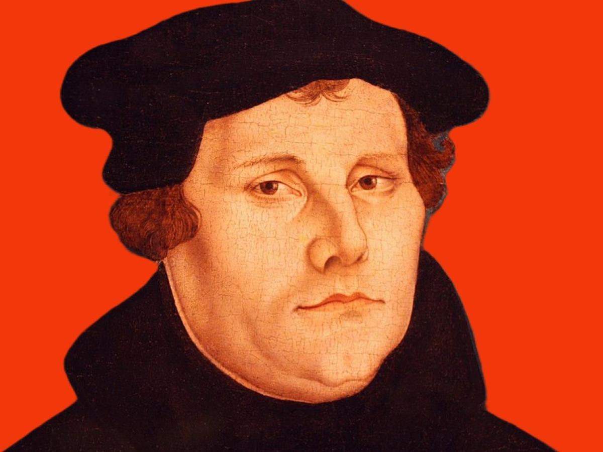 A head and shoulder painting of Martin Luther against a red background