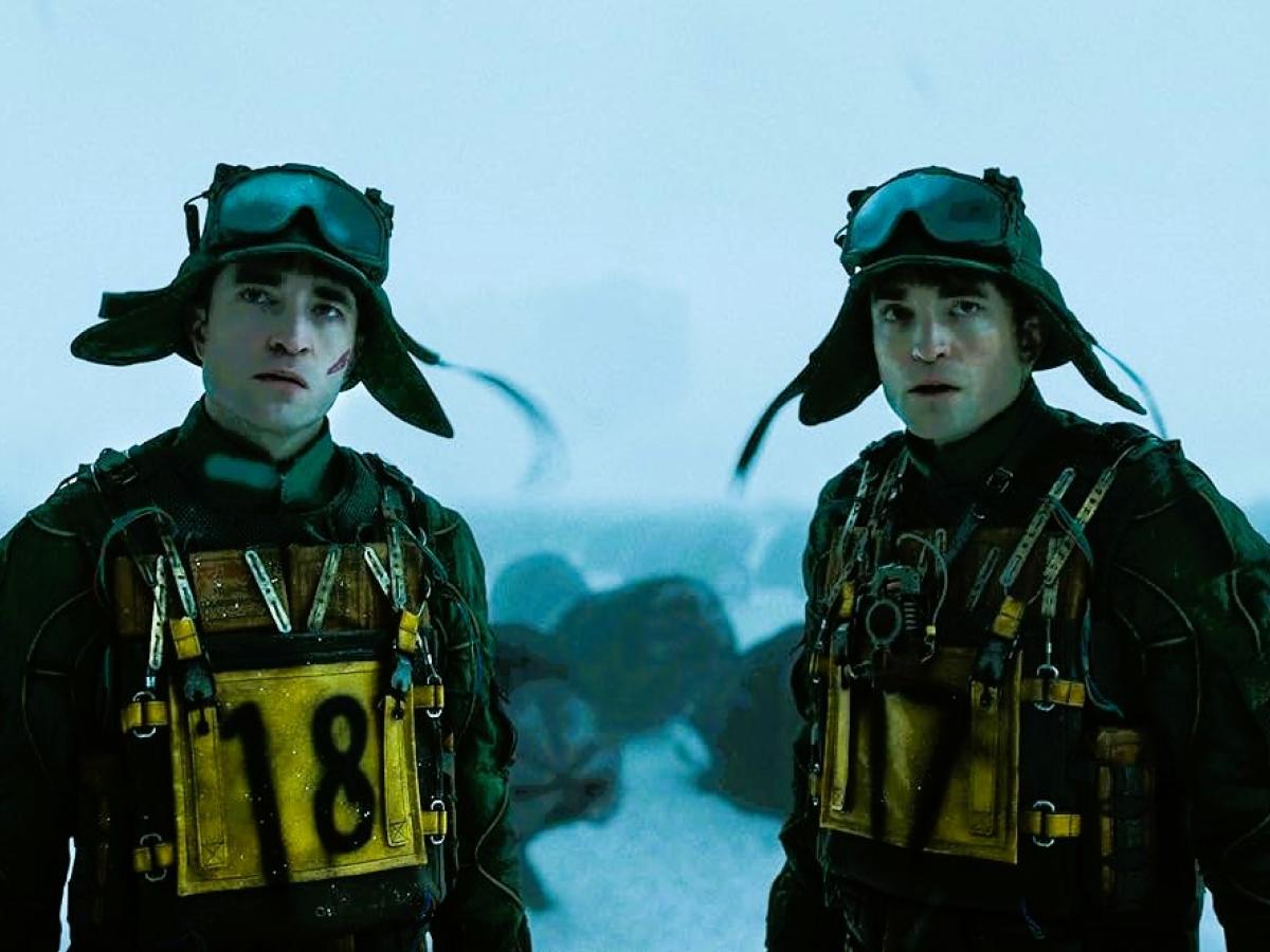 Two cloned humans stand side by side.