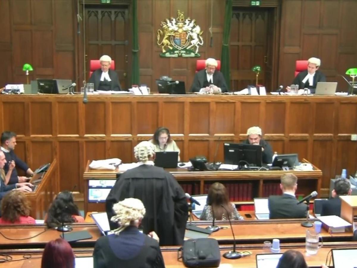 A court sits, with judges raised above the others.
