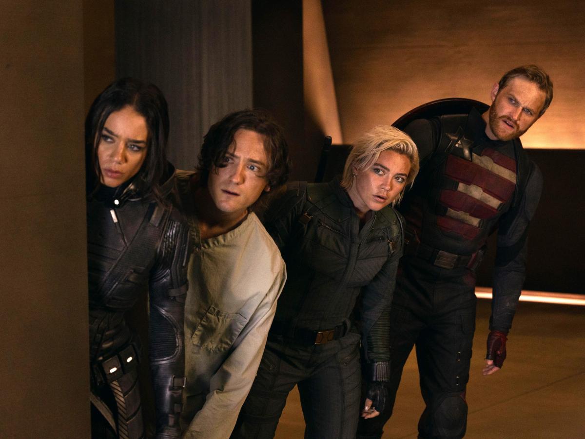 Four characters from a film loop warily to the side.