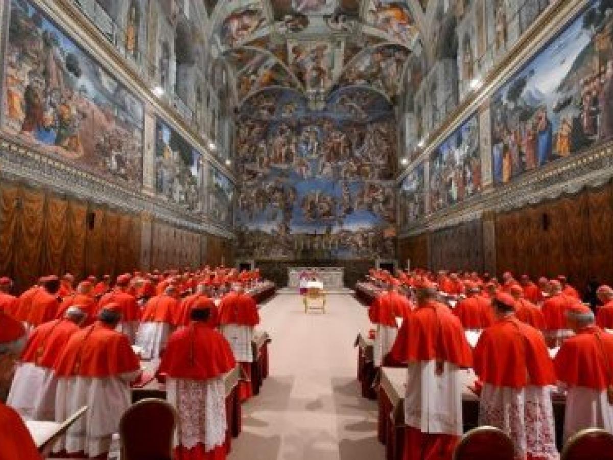 A gather of cardinals in the Sistene Chapel.