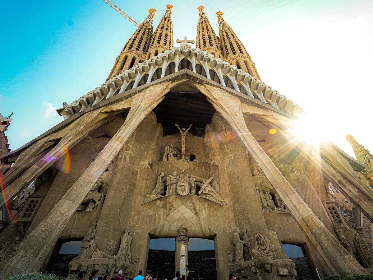 Looking up at the front of Gaudi's cathedra; as the sun comes out from behind the spires.