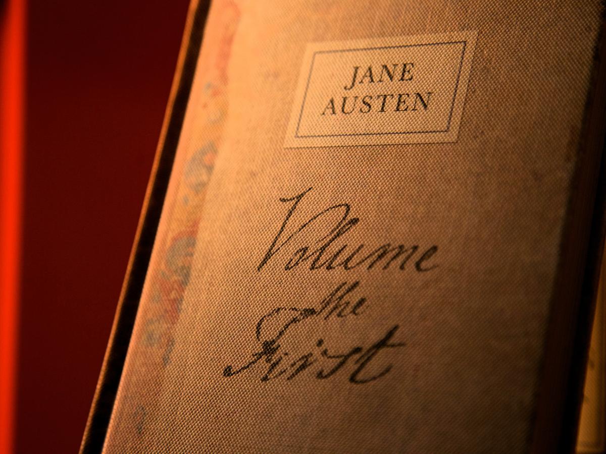 A book cover with a handwritten title that reads: Jane Austen volume the first