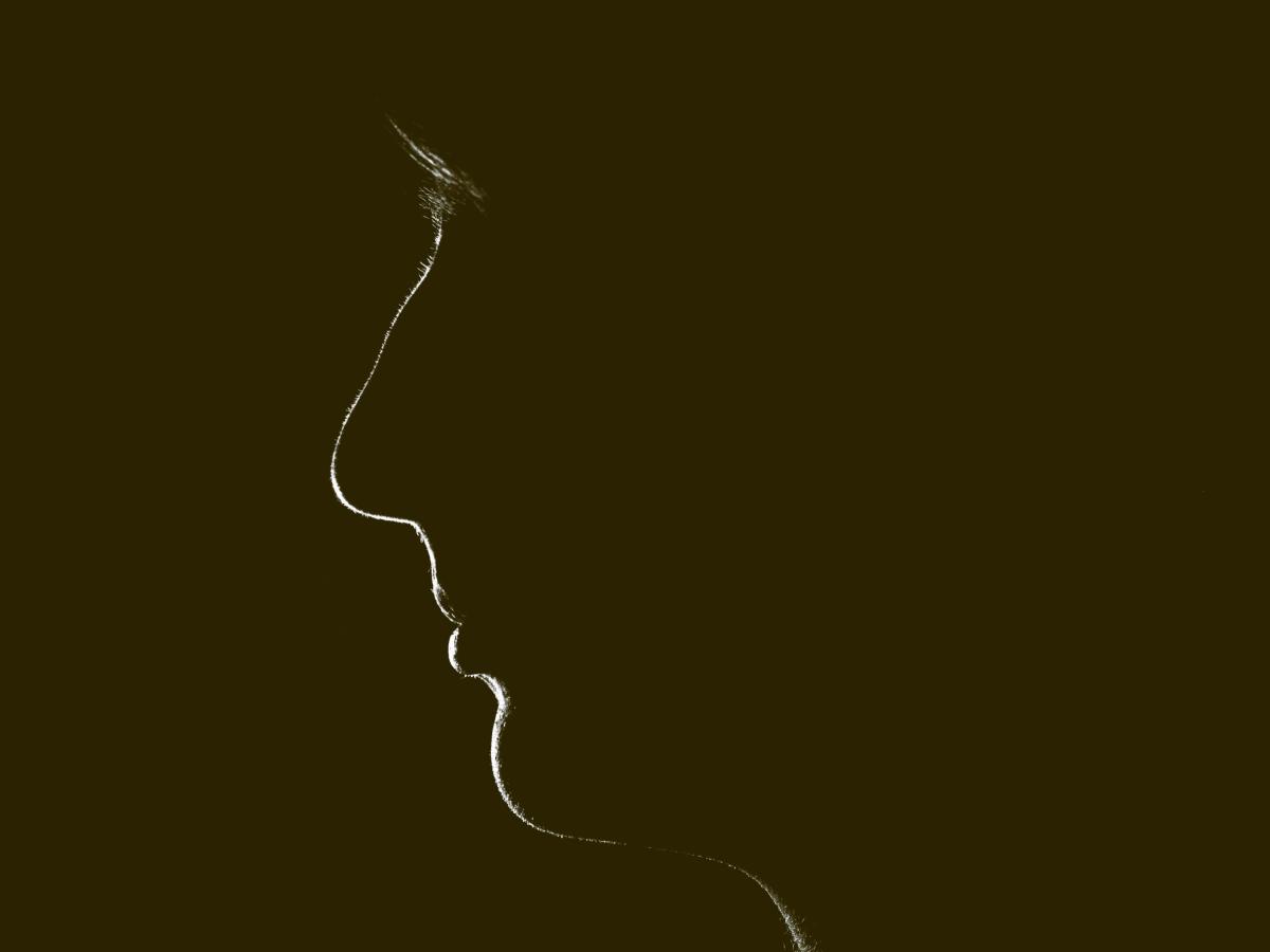 A silhouette of a woman's face.