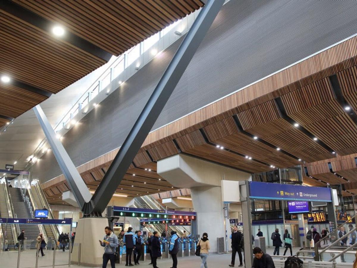 A station concourse with a light well above.
