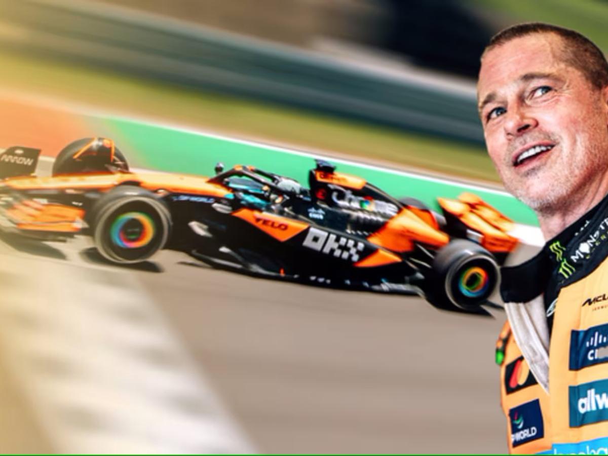 Brad Pitt dressed as a racing driver stands with a car in the background