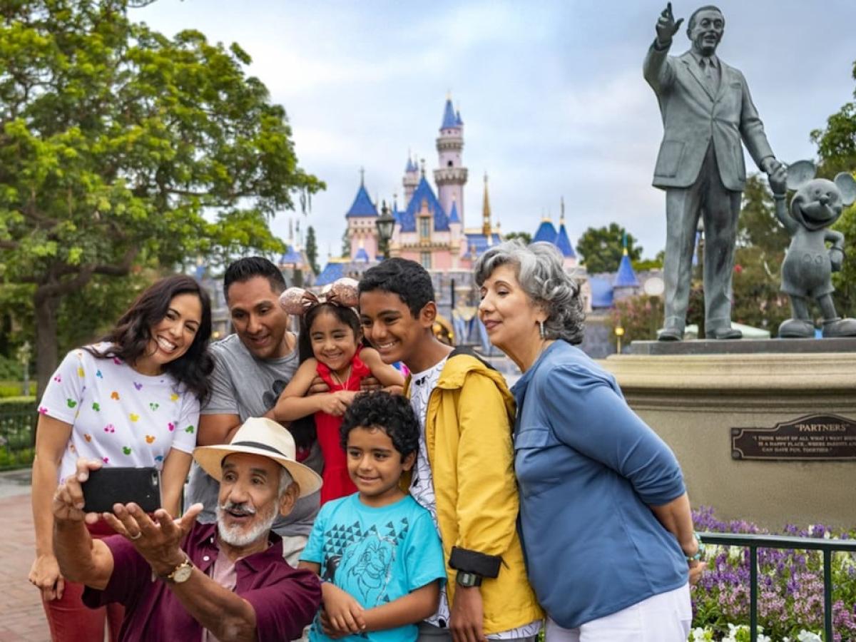A family pose for a picture at Disneyland