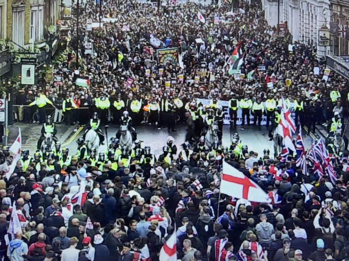 CCTV footage show two rival protests divided by a line of riot police.