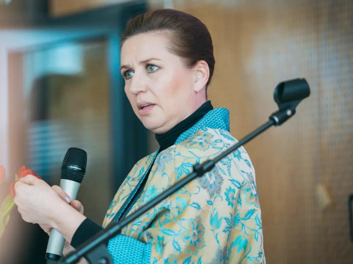 Mette Frederiksen gesture as she delivers a speech. 