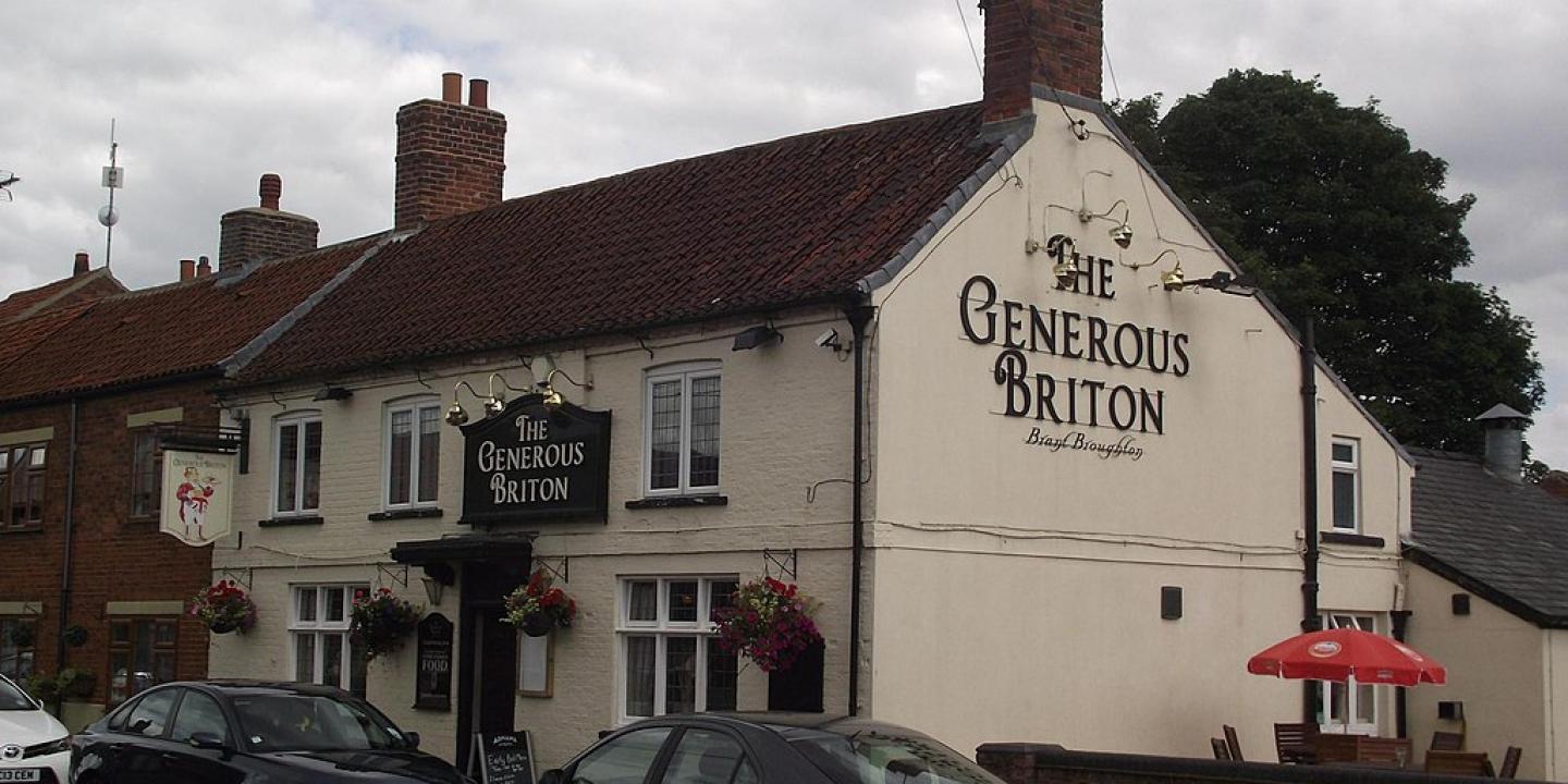 A village pub with its name on the gable end: The Generous Briton