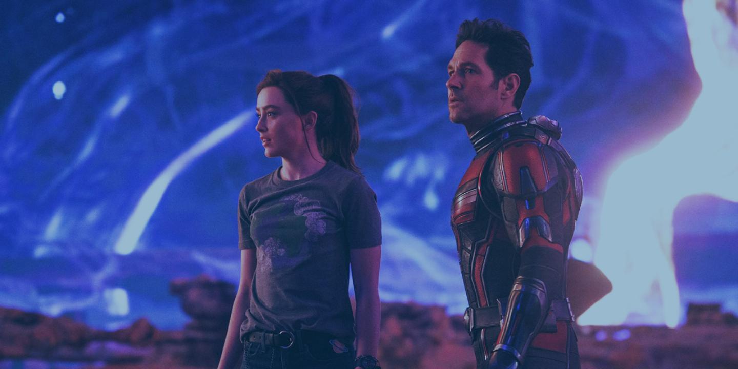 Father and daughter super heroes stand and look to the left.