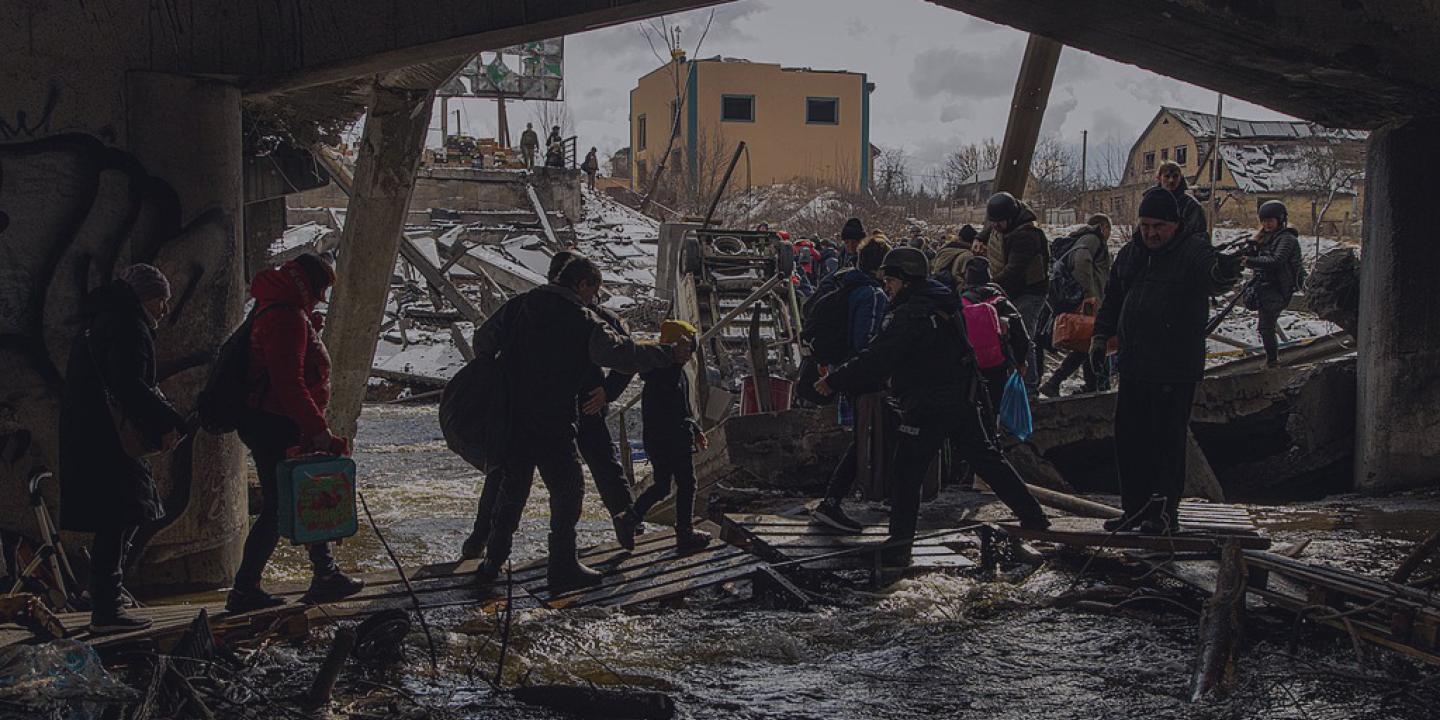 Civilian evacuation across Irpin River during the Ukraine War.