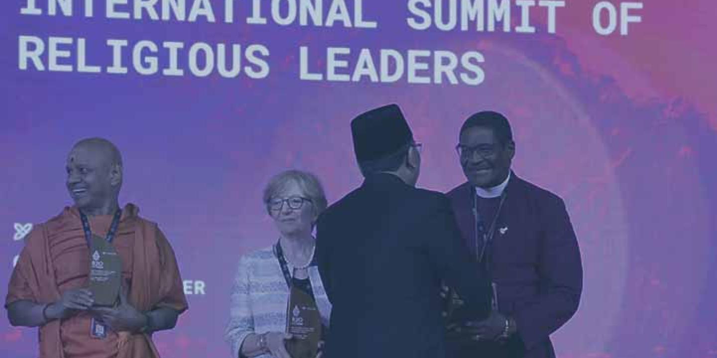Swami Govinda Dev Giri Maharaj, Dr. Valeria Martano, and Archbishop Henry Ndukuba, are greeted by R20 founder Yahya Cholil Staquf.