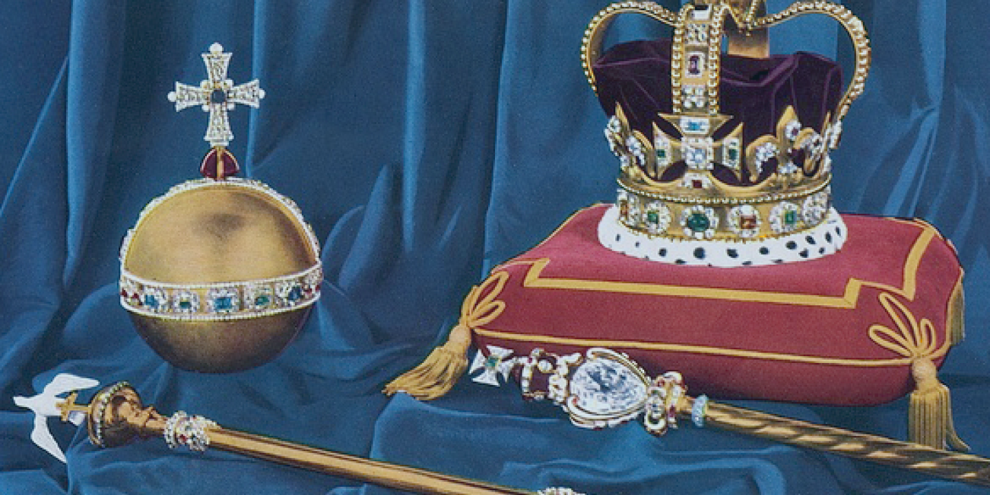 A crown, orb and sceptre rest on velvet cushions.