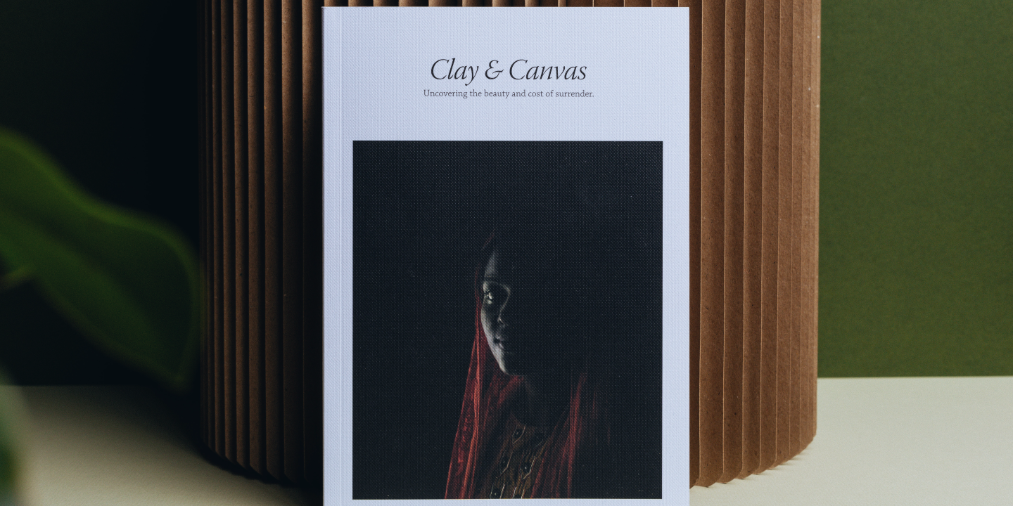 A refugee looks out from a cover photograph of a book resting upright against a cylinder
