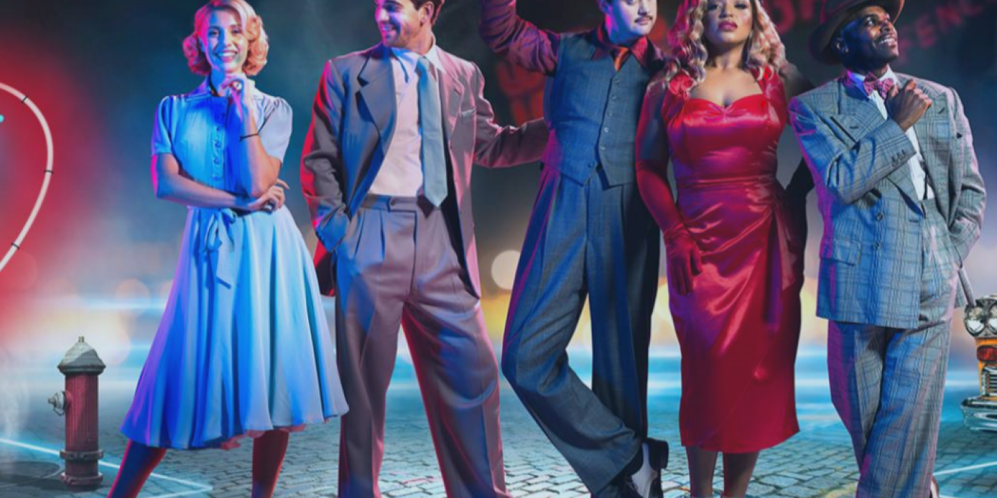 Five actors stand dressed in 50s clothing.