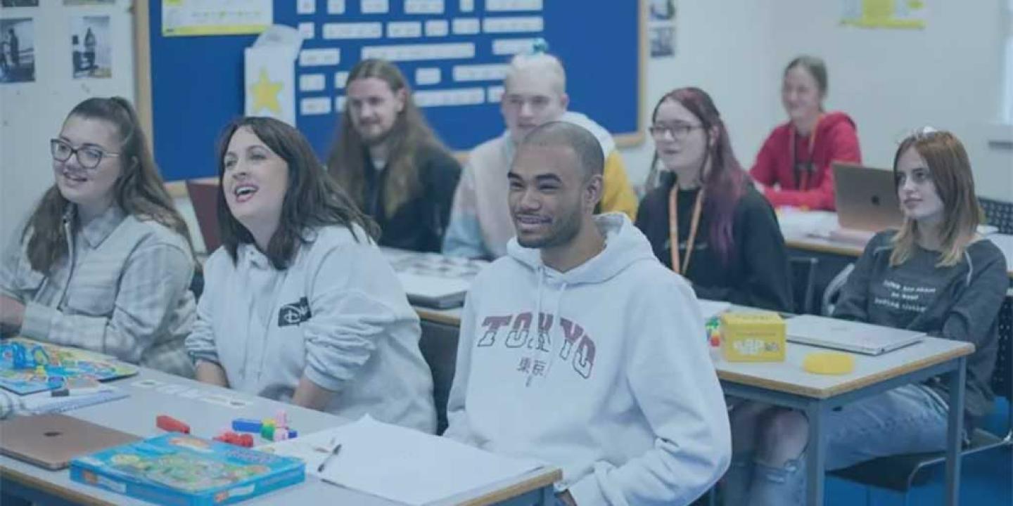 Students sit in a classroom.