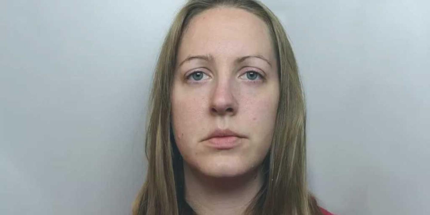 A prisoner looks into the camera.