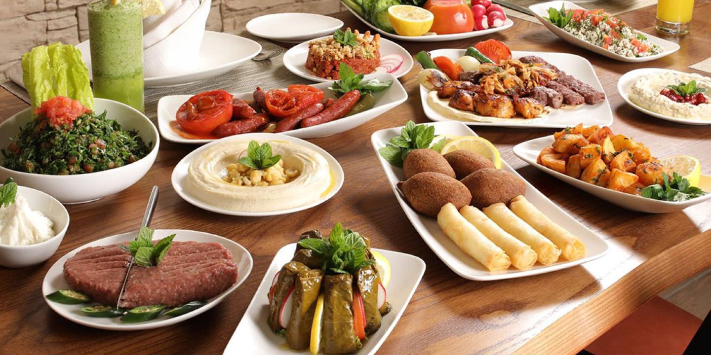 a Lebanese meal of many dishes displayed on a table.