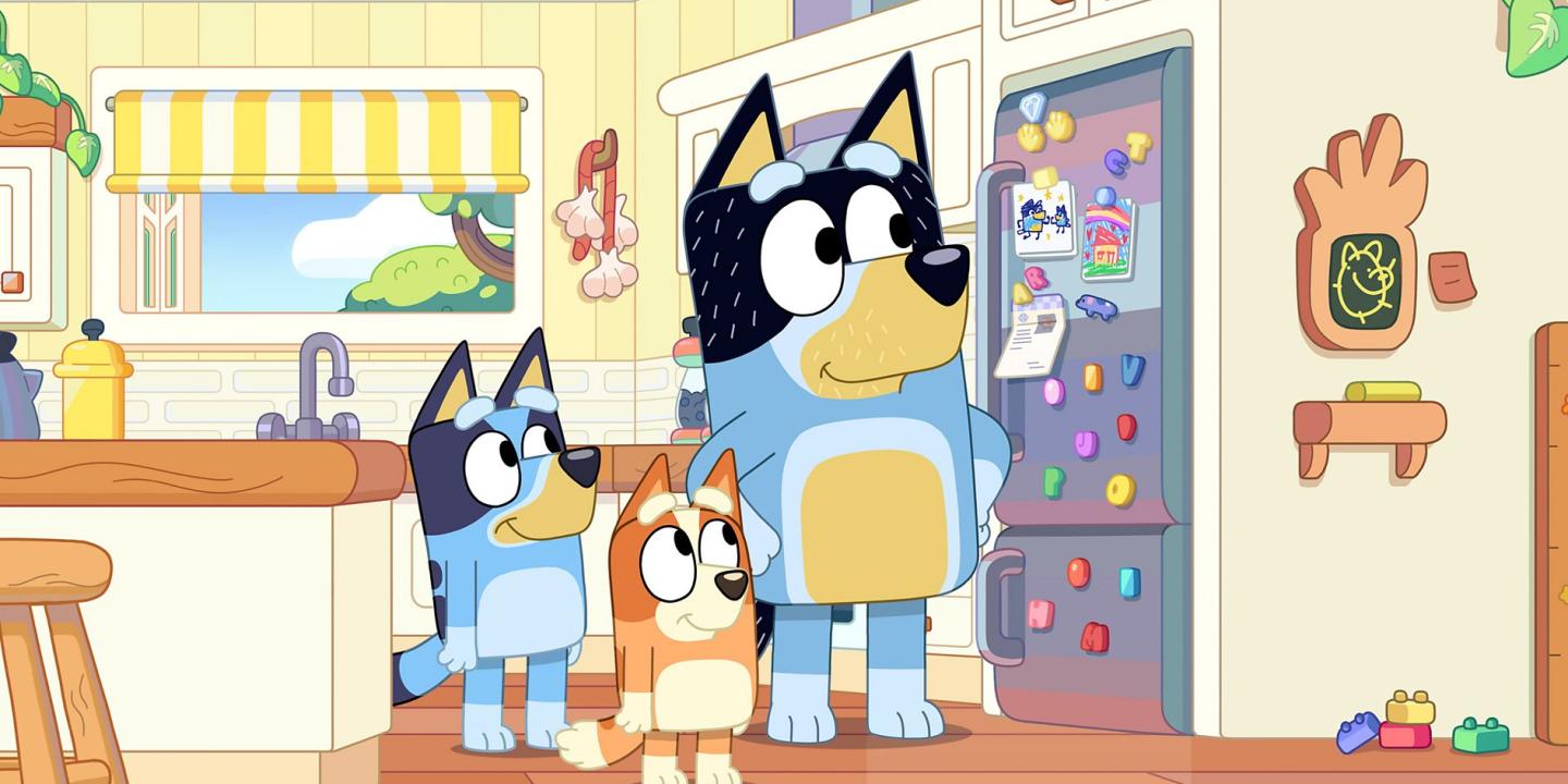 A cartoon dog family stand in their kitchen