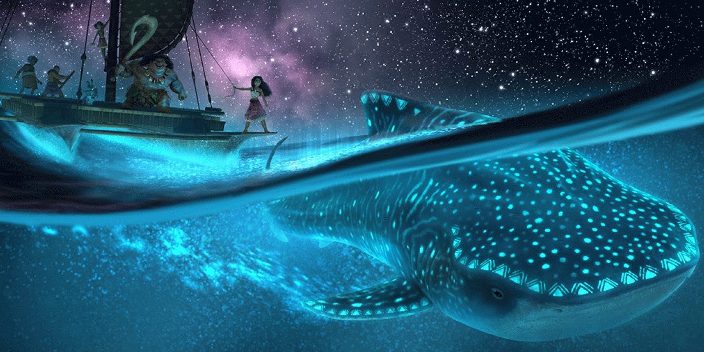 A cartoon still shows a nightscape at sea with a Polynesian style vessel above, with Moana standing on it sailing above a whale illuminated by bioluminescence 