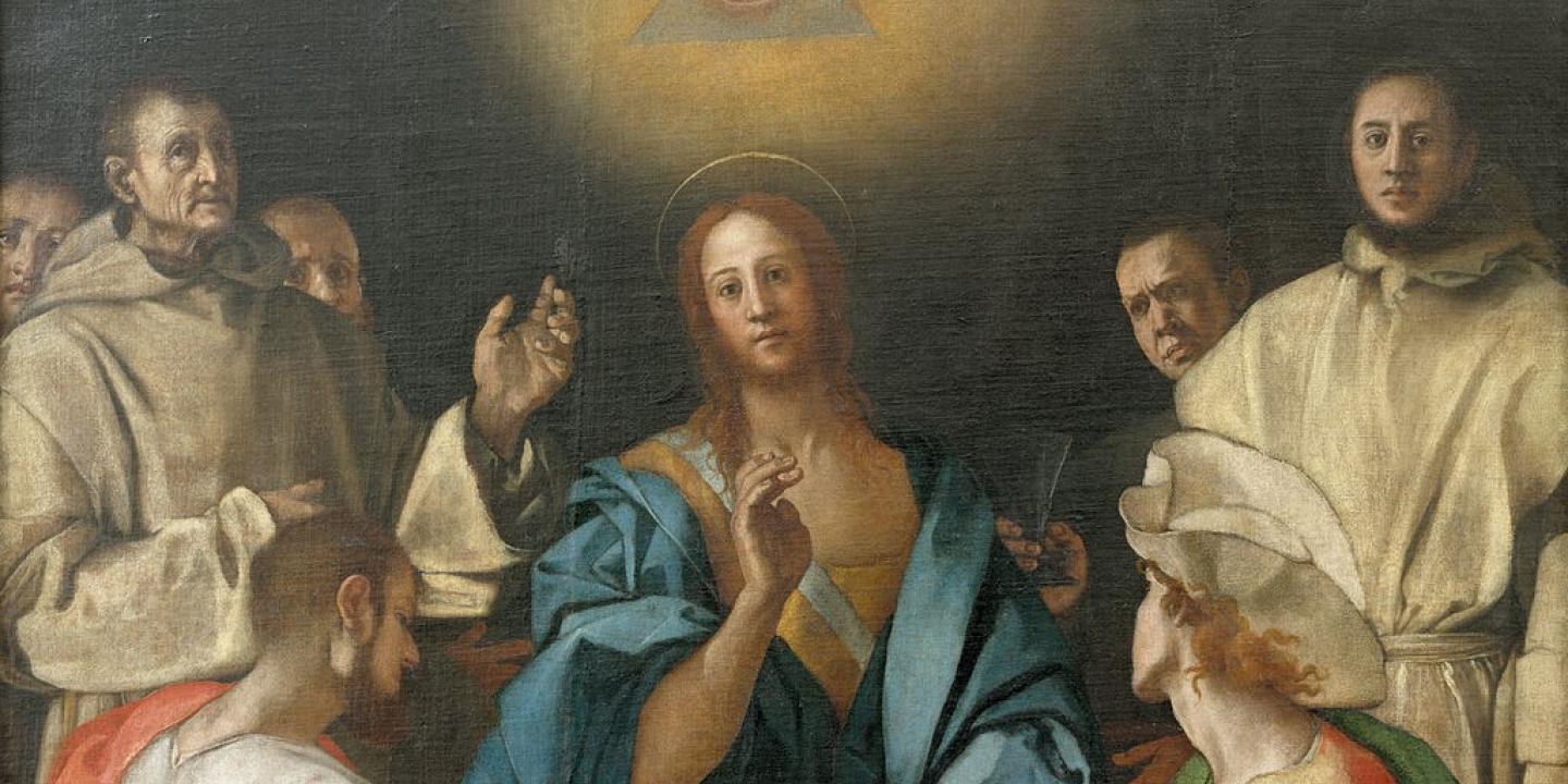 an all seeing eye hovers above a renaissance style picture of the supper at Emmaus.