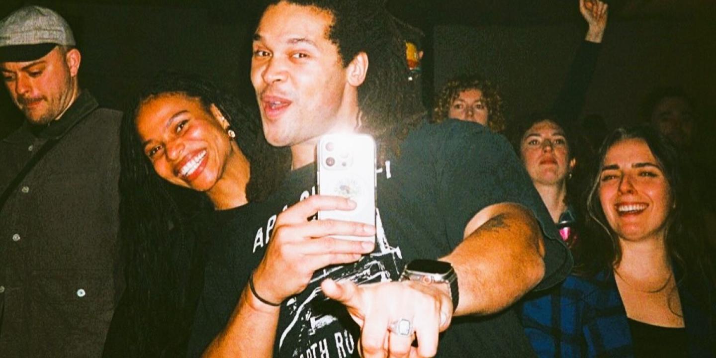 Ravers pose together for a selfie.
