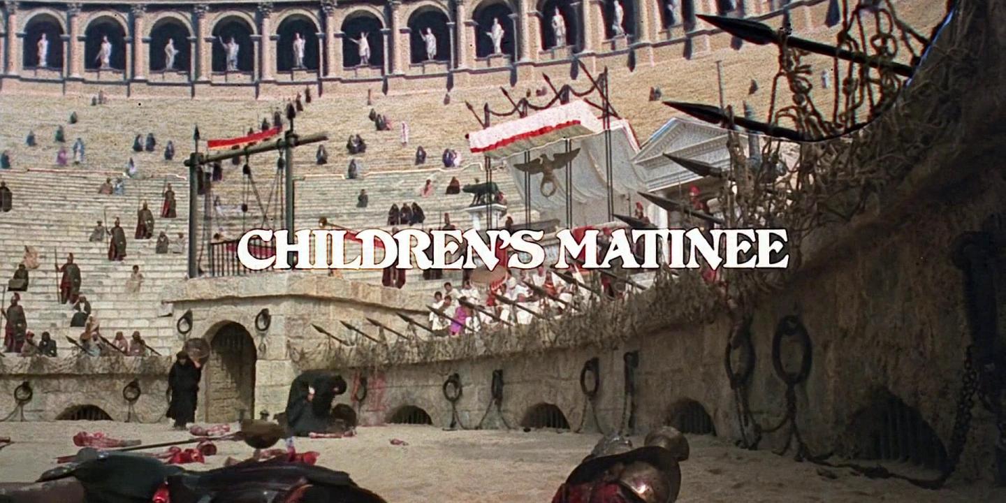 A movie still shows a Roman amphitheatre, covered in body parts, over which a sign reads 'children's matinee'.