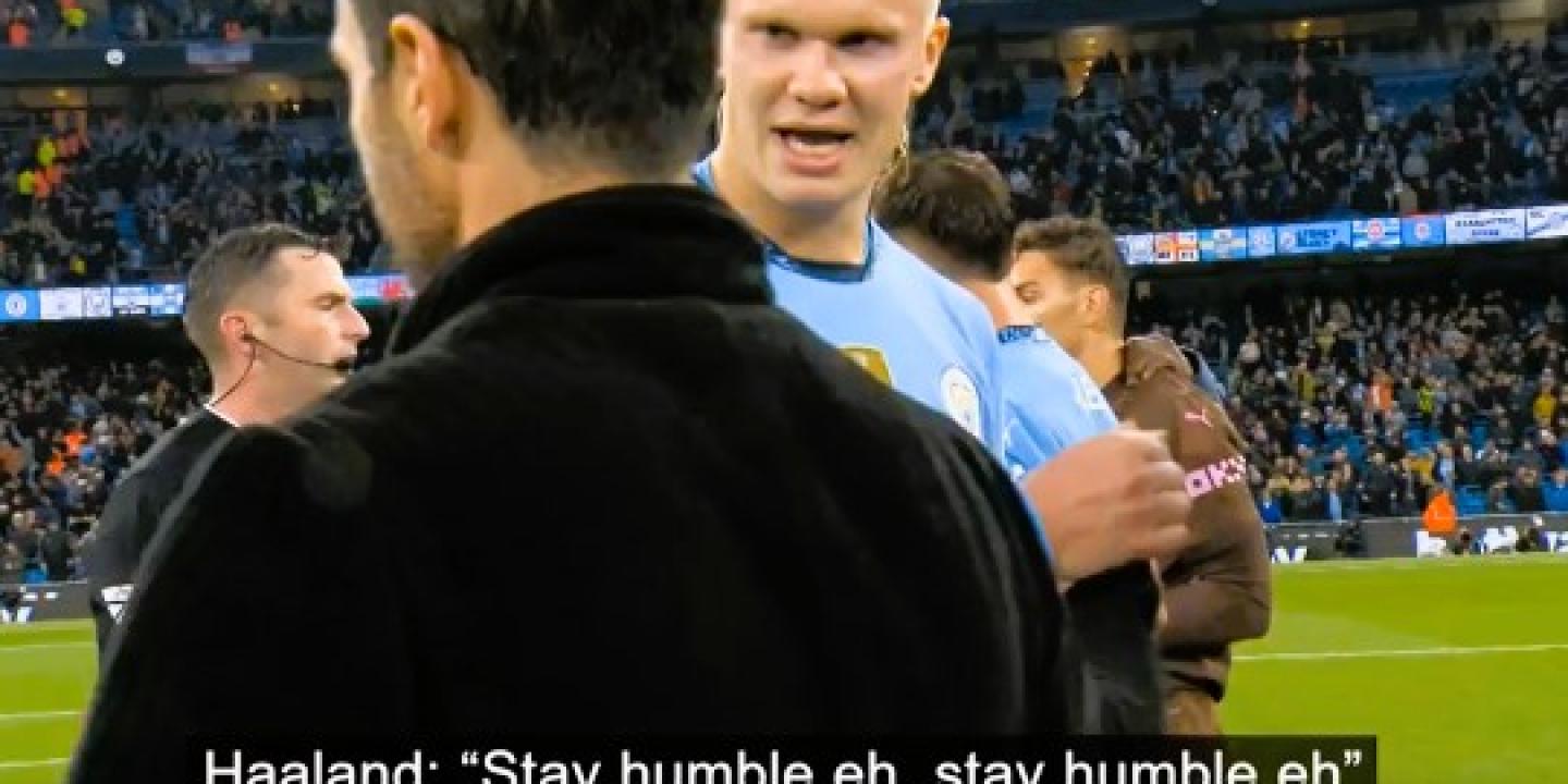 A TV screengrab shows a football manager walking while a passing rival player says (captioned) 'stay humble'.