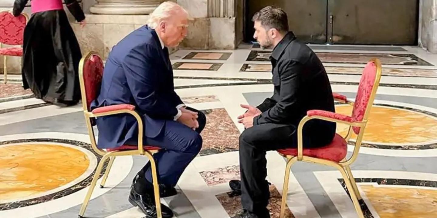 Trump and Zelensky sit and face each other.