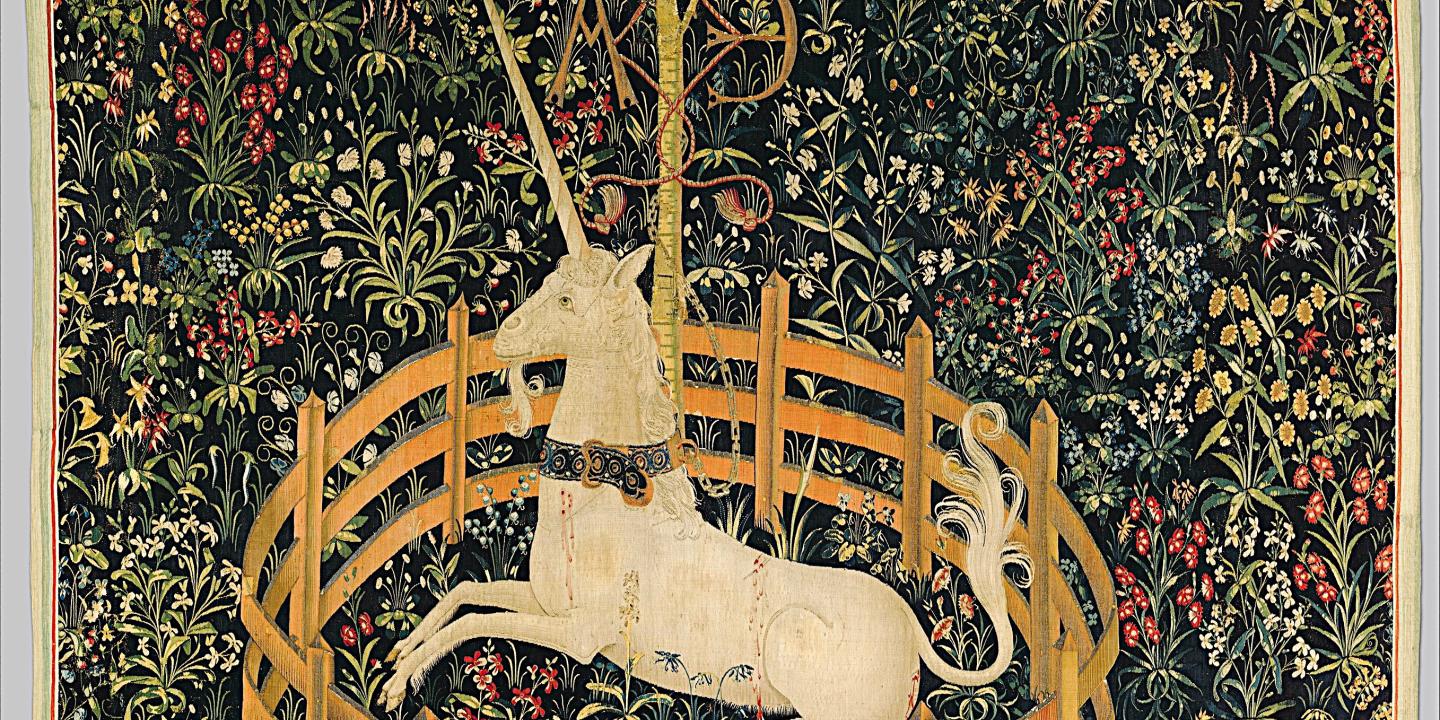 A tapestry depicts a unicorn resting within a fenced enclosure.