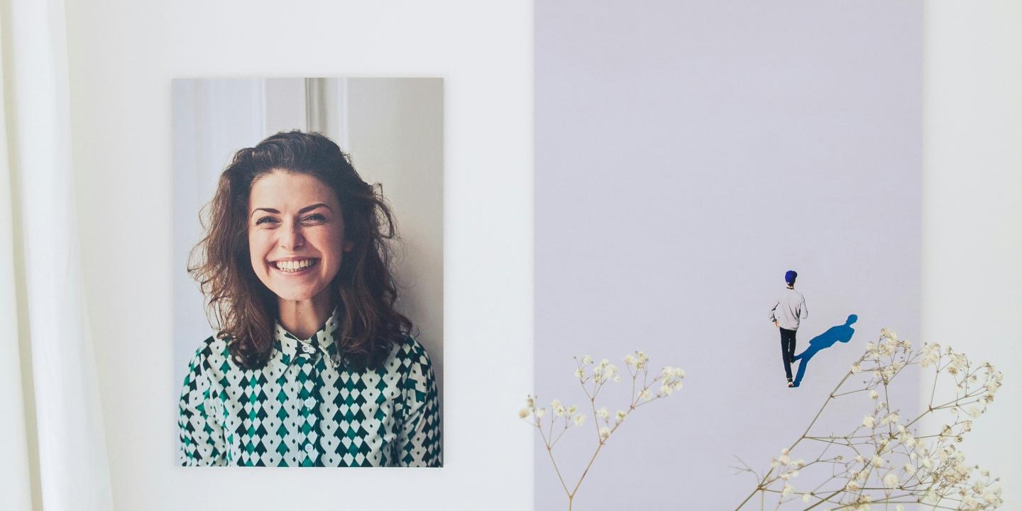 A composite show a smiling woman next to a small illustrate of someone walking off into the distance.