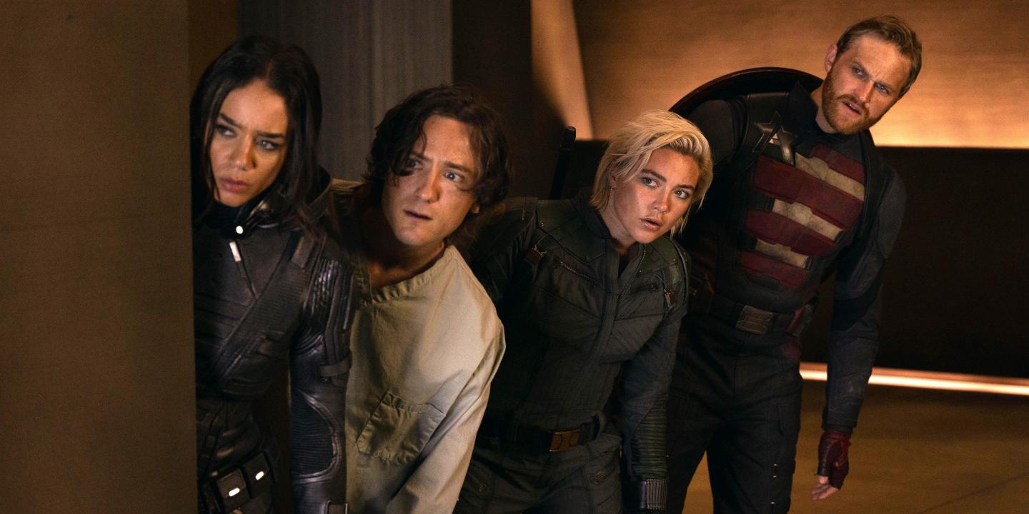 Four characters from a film loop warily to the side.
