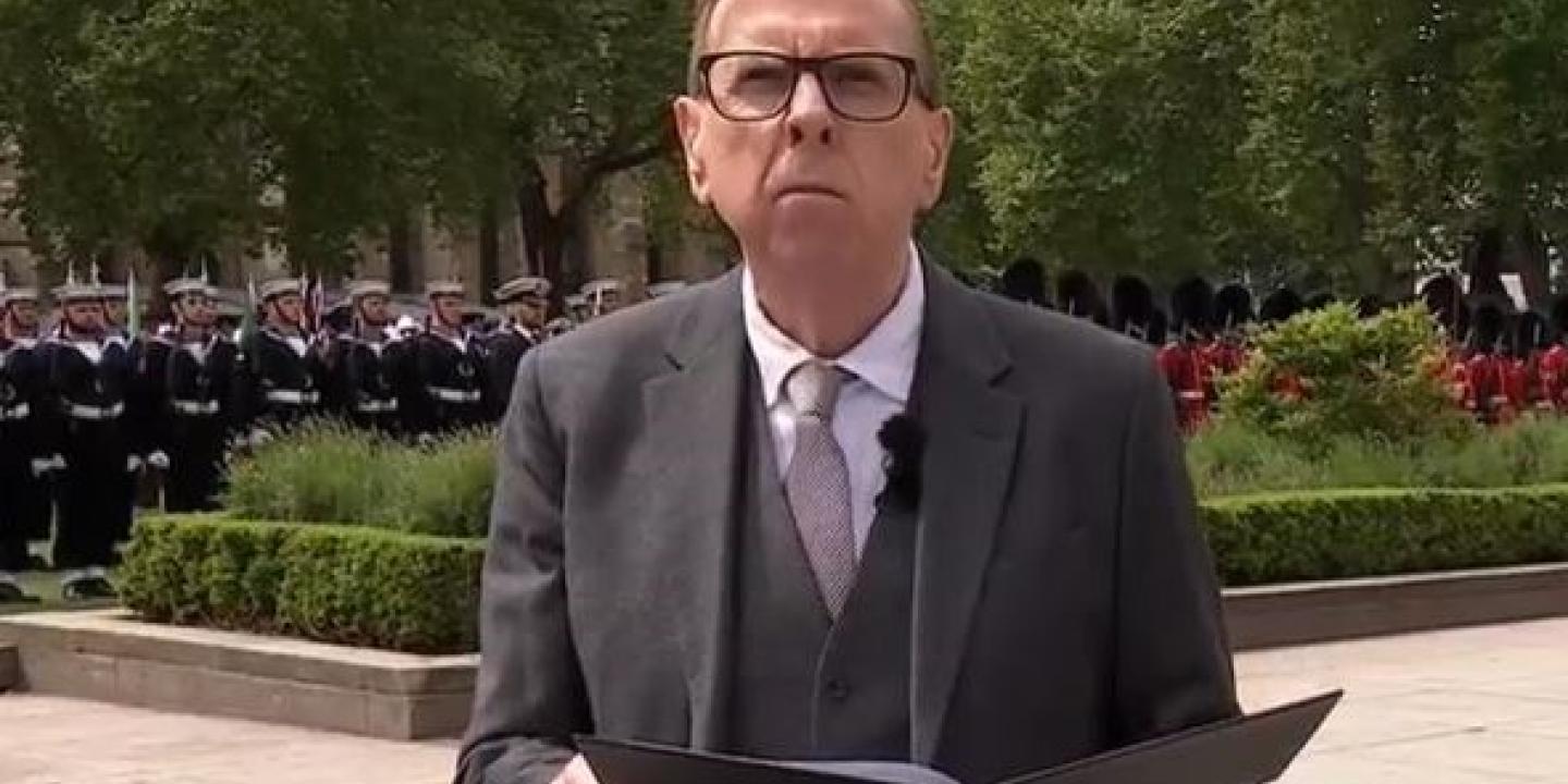 An actor reads a speech at a commemoration