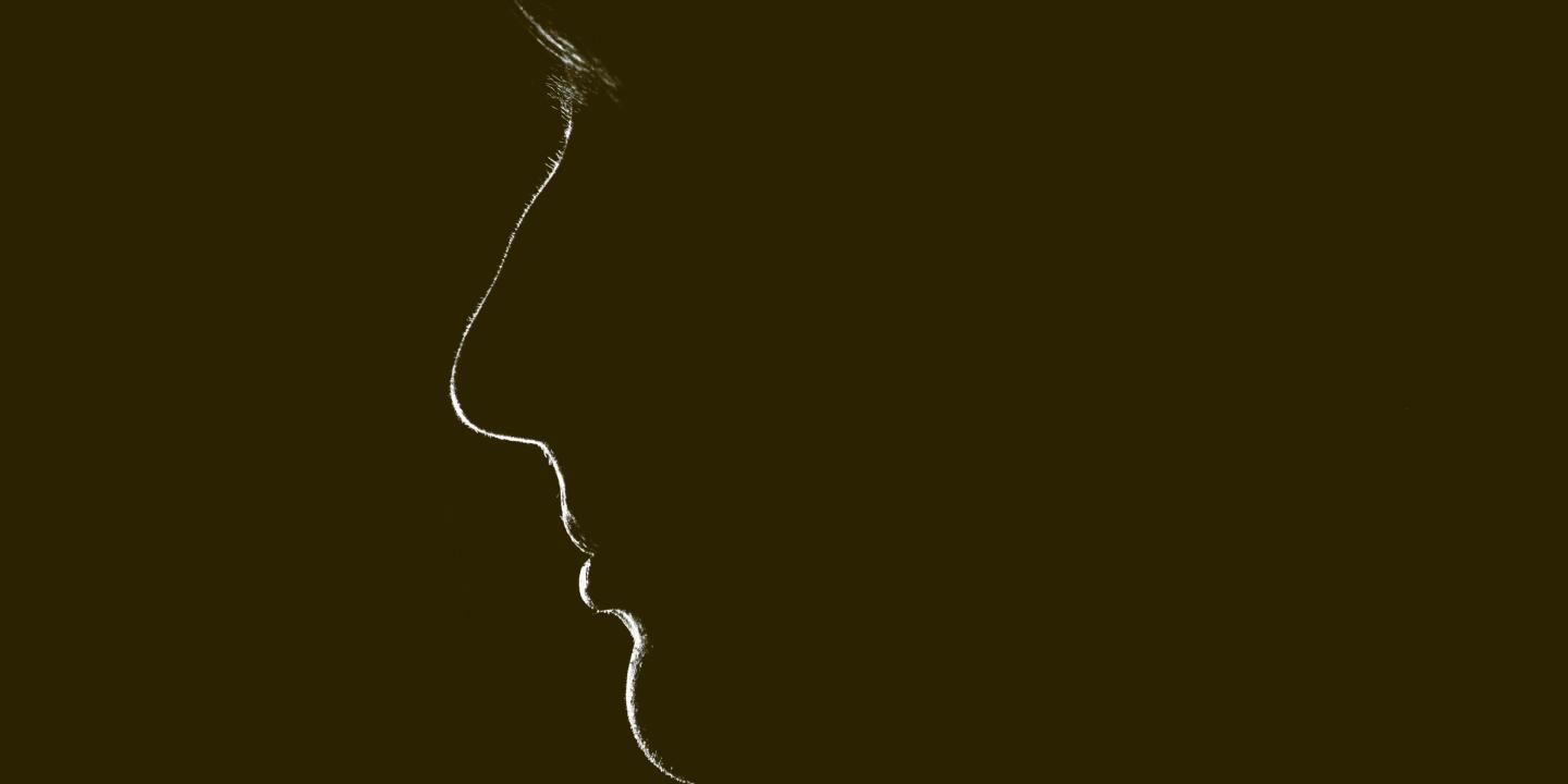 A silhouette of a woman's face.