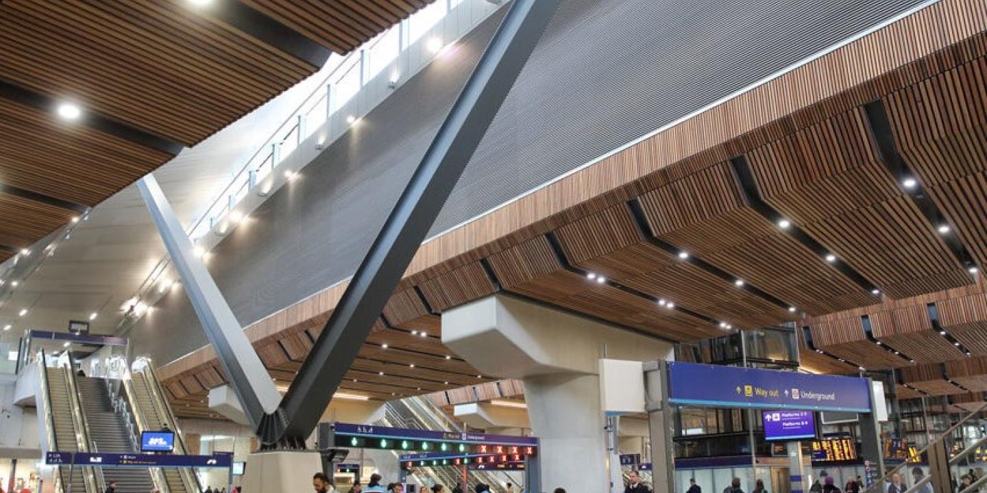 A station concourse with a light well above.
