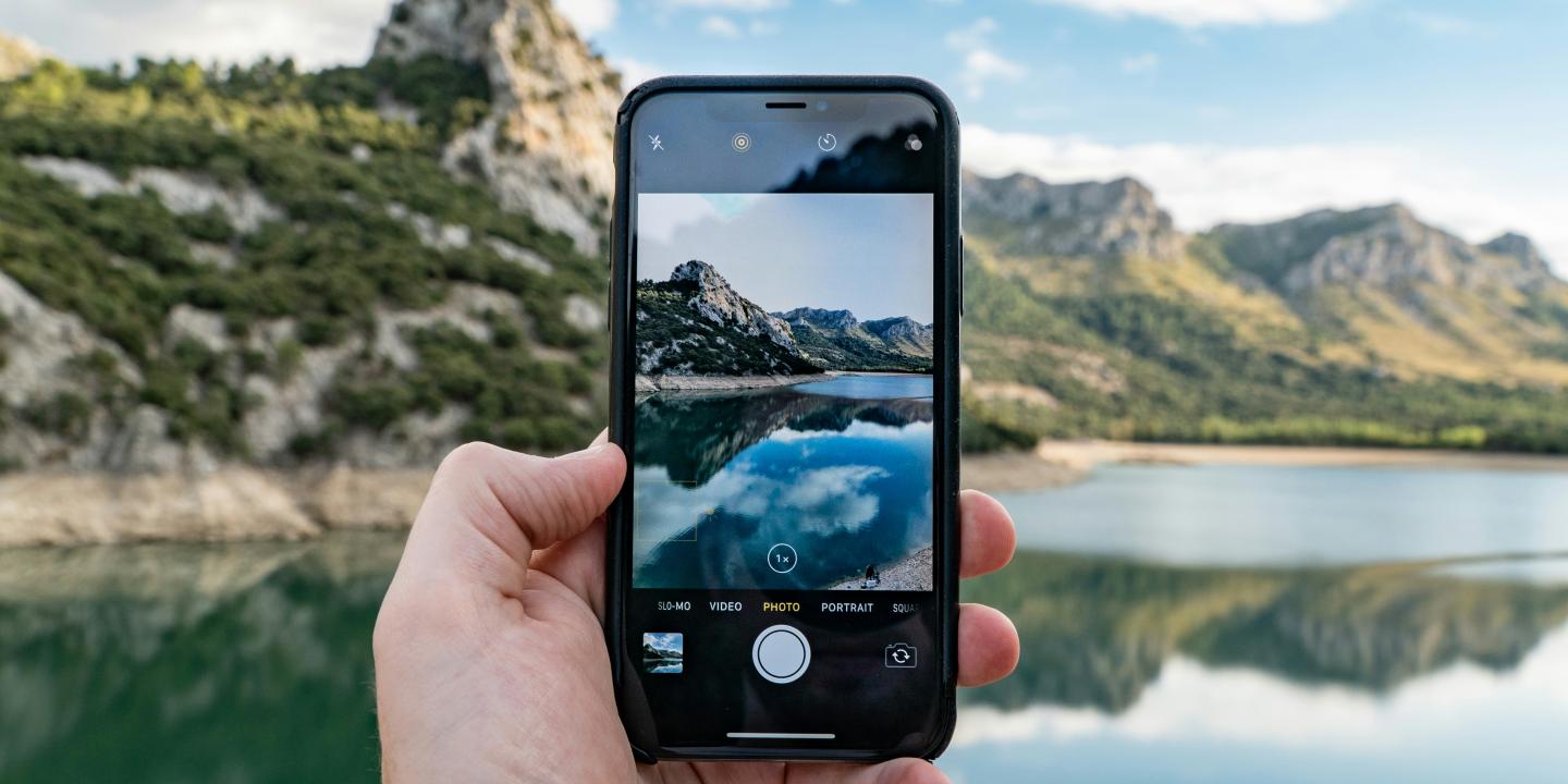A phone shows a picture of the real view behind it.