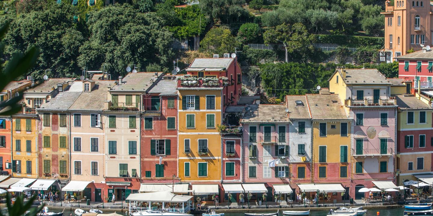 A colourful row of buildings in an Italian port.