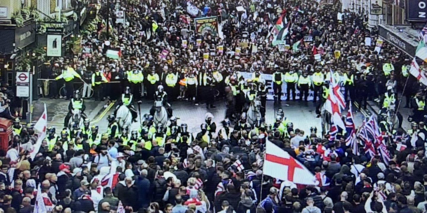 CCTV footage show two rival protests divided by a line of riot police.