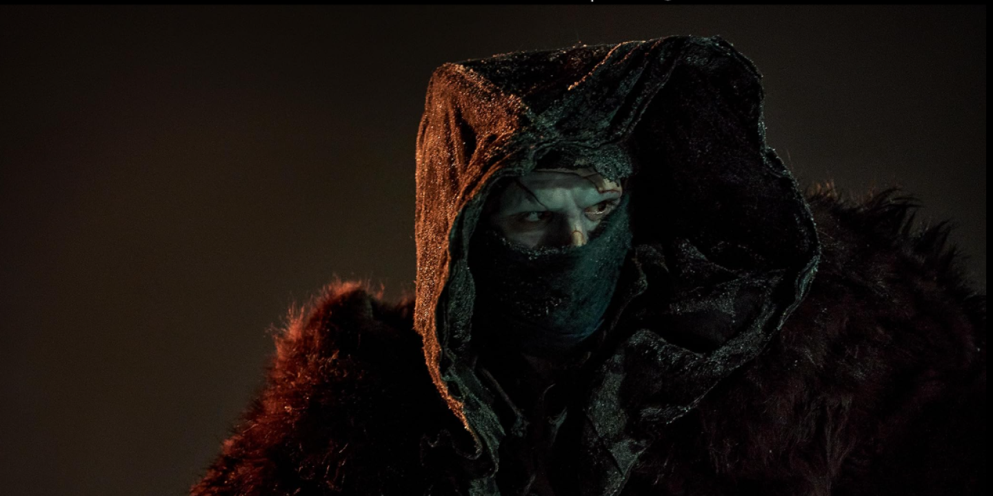 Frankstein stares our from his covered face.