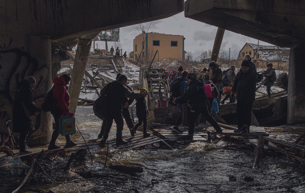 Civilian evacuation across Irpin River during the Ukraine War.