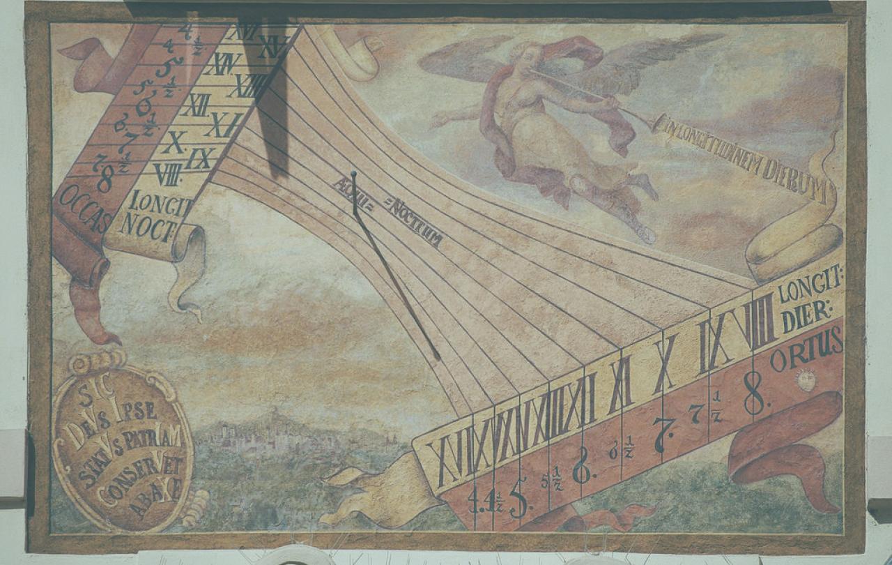 A sundial on a wall casts a small shadow on a painted list of numbers and symbols